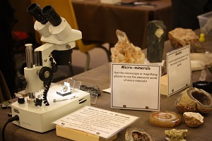 microscope and rocks on table